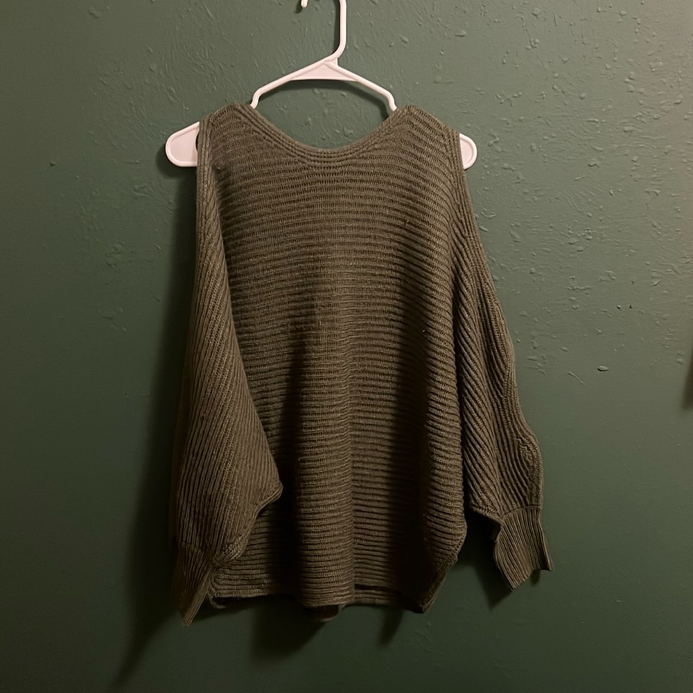 oversized green sweater with shoulder and arm slit